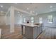 Open concept kitchen with gray cabinetry and large island at 26 Homesite Cooper E Cv, Fayetteville, GA 30214