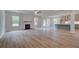 Open living space with hardwood floors and fireplace at 26 Homesite Cooper E Cv, Fayetteville, GA 30214
