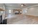 Open living room with kitchen view and fireplace at 26 Homesite Cooper E Cv, Fayetteville, GA 30214