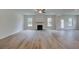 Bright living room featuring a fireplace and hardwood floors at 26 Homesite Cooper E Cv, Fayetteville, GA 30214