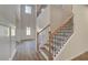Elegant staircase with wrought iron railing and hardwood steps at 26 Homesite Cooper E Cv, Fayetteville, GA 30214