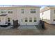Exterior shot showing the back of the house with a small patio and a fenced backyard at 2881 Grandin Way, Marietta, GA 30008