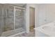 Modern bathroom featuring a glass-enclosed shower with stylish tile and a dual sink vanity at 2881 Grandin Way, Marietta, GA 30008