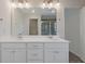 Bathroom with double vanity, stylish fixtures and a large, well-lit mirror at 2881 Grandin Way, Marietta, GA 30008