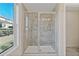 Bright bathroom showcasing a tiled shower with glass door and a view from the window at 2881 Grandin Way, Marietta, GA 30008