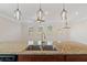 Granite kitchen island with a double sink and stainless steel appliances, flooded with natural light at 2881 Grandin Way, Marietta, GA 30008