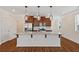 Spacious kitchen with an island, stainless steel appliances, and stylish pendant lights at 2881 Grandin Way, Marietta, GA 30008