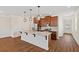 Updated kitchen with granite island, hardwood floors, stainless steel appliances and pendant lighting at 2881 Grandin Way, Marietta, GA 30008