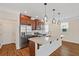 Bright kitchen with stainless steel appliances, a kitchen island, and hardwood floors at 2881 Grandin Way, Marietta, GA 30008