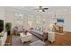 Cozy living room with neutral decor, hardwood flooring, and a view of the dining area at 2881 Grandin Way, Marietta, GA 30008