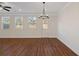Bright and airy living area with hardwood floors, three windows and a glass door at 2881 Grandin Way, Marietta, GA 30008
