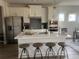 Modern kitchen with stainless appliances, breakfast bar, and ample counter space at 4341 Portsbrook Ave, Snellville, GA 30039