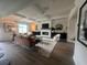 Bright, spacious living room with coffered ceilings, large windows, and hardwood floors at 4341 Portsbrook Ave, Snellville, GA 30039
