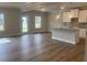 Bright living room with wood flooring and modern kitchen area at 4341 Portsbrook Ave, Snellville, GA 30039