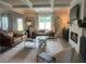 Cozy living room with fireplace, coffered ceilings, and hardwood floors at 4341 Portsbrook Ave, Snellville, GA 30039
