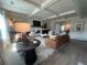 Open concept living room and dining room with coffered ceilings and hardwood floors at 4341 Portsbrook Ave, Snellville, GA 30039