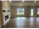 Stylish living room with a fireplace and large windows providing ample natural light at 4341 Portsbrook Ave, Snellville, GA 30039
