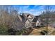 Expansive estate-style home with manicured lawns, mature trees and brick exterior at 6163 Talmadge Nw Run, Acworth, GA 30101