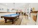 Basement with billiard table, wet bar and unique lighting fixtures and nautical decorations at 6163 Talmadge Nw Run, Acworth, GA 30101