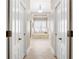 Bathroom hallway leading to large tub and natural light at 6163 Talmadge Nw Run, Acworth, GA 30101