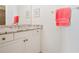 Bathroom featuring vanity with granite counters, white cabinets, mirror, and towel bar at 6163 Talmadge Nw Run, Acworth, GA 30101