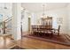 Bright dining area with wood floors, chandelier, and traditional furniture at 6163 Talmadge Nw Run, Acworth, GA 30101