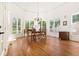 Elegant dining room with natural light, chandelier, and hardwood floors at 6163 Talmadge Nw Run, Acworth, GA 30101