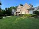 Charming brick home featuring a beautifully manicured front yard and classic architectural details at 6163 Talmadge Nw Run, Acworth, GA 30101