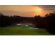 Scenic golf course view at sunset showcasing lush green fairways and sand traps at 6163 Talmadge Nw Run, Acworth, GA 30101