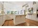 Bright kitchen with a central island, granite countertops, and stainless steel appliances, offering a contemporary cooking space at 6163 Talmadge Nw Run, Acworth, GA 30101