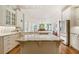 Spacious kitchen with granite countertops, custom cabinets, and stainless steel appliances at 6163 Talmadge Nw Run, Acworth, GA 30101