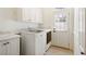 Laundry room with washer, dryer, and a utility sink at 6163 Talmadge Nw Run, Acworth, GA 30101