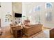 Open living room with a stone fireplace, large windows, and hardwood floors at 6163 Talmadge Nw Run, Acworth, GA 30101