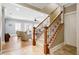 Entryway to the spacious living room, with staircase and hardwood floors at 6163 Talmadge Nw Run, Acworth, GA 30101