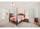 Spacious main bedroom with ceiling fan, sitting area, and natural light at 6163 Talmadge Nw Run, Acworth, GA 30101