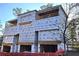 Exterior view of new construction home featuring contemporary design and unfinished facade showcasing future curb appeal at 00 Kingsboro Rd # 1, Atlanta, GA 30326