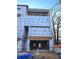 An in-progress exterior of the building showing construction elements and branded protective wrap at 00 Kingsboro Rd # 1, Atlanta, GA 30326