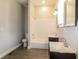 Updated bathroom with subway tile and double vanity at 1847 New Ne St, Conyers, GA 30012