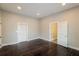 Spacious bedroom with dark hardwood floors and an en-suite bathroom at 1847 New Ne St, Conyers, GA 30012