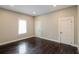 Spacious bedroom with hardwood floors and neutral walls at 1847 New Ne St, Conyers, GA 30012