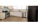 Renovated kitchen with granite countertops and stainless steel appliances at 1847 New Ne St, Conyers, GA 30012