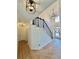 Grand foyer with herringbone wood floors, staircase, and modern light fixtures at 3390 Vista Creek Dr, Dacula, GA 30019