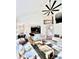 Open-concept living area with modern furnishings, a kitchen island, and elegant dining space at 3390 Vista Creek Dr, Dacula, GA 30019