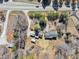 Aerial view of property featuring the home, sheds, and surrounding area at 1891 Highway 81 E, Mcdonough, GA 30252