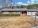 Charming brick home with well-maintained lawn and welcoming entrance, perfect for a cozy Gathering at 1891 Highway 81 E, Mcdonough, GA 30252