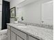 Bathroom with granite countertop and gray cabinets at 3152 Birdsong Ave, Covington, GA 30016