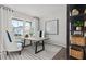 Bright home office features a large window, built-in shelving, and comfortable seating at 3152 Birdsong Ave, Covington, GA 30016