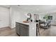 Kitchen island with granite countertops and gray cabinets at 3152 Birdsong Ave, Covington, GA 30016