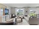 Open living area with large sectional sofa and plenty of natural light at 3152 Birdsong Ave, Covington, GA 30016