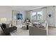 Spacious living room with gray sofa, large windows, and stylish decor at 3152 Birdsong Ave, Covington, GA 30016